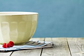 A ceramic bowl on a tea towel