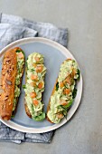 Eclairs with avocado cream, salmon and dill