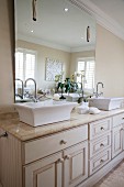 Elegant, American-style washstand with twin sinks and large mirror