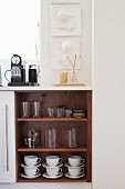 Crockery in open-fronted kitchen base unit