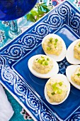 Devilled eggs on a blue plate