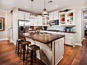 Stools arranged at breakfast bar in kitchen; Carlsbad; California; USA