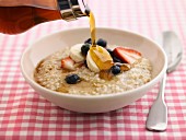 Porridge with fruits and maple syrup