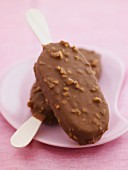 Chocolate covered ice cream sticks studded with toffee