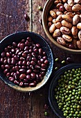 Azuki beans, green beans and borlotti beans in bowls