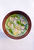 Courgette soup with soy yogurt, vanilla and radishes