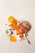 Salmon fillet with mandarin slices, horseradish, cress and sea salt