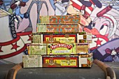 Cigar boxes stacked on old trunk against comic-style backdrop