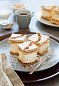 Mil folhas (puff pastry pudding cakes, Portugal) with icing sugar and cinnamon served with coffee
