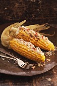 Corn on the cob with chilli and grated Parmesan