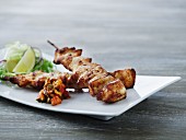 Chicken skewers with relish and salad