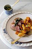 Fried duck breast with pumpkin gnocchi and green mint sauce
