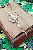 Wooden crate used as picnic hamper with name tag