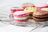 Various macaroons on a glass plate