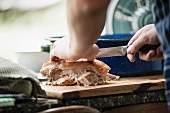 Roast pork being sliced