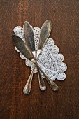 Fish knives on a doily