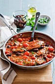 Vitello alla caprese (veal escalope in tomato sauce with olives)