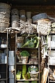Wicker baskets and plant pots stacked on a shelf