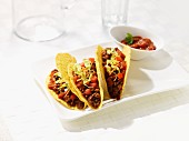 Corn tortillas filled with beef and bean salsa
