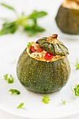 Stuffed courgettes filled with millet and vegetables