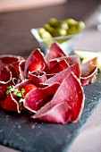 Bresaola with cherry tomatoes in a restaurant
