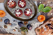 Vegan cupcakes with apricots and plums on a rustic table