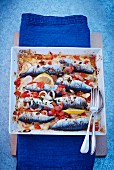 Oven-roasted sardines with tomatoes and lemon