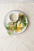 Bulgur salad with broad beans, poached egg, peaches and a mustard and yoghurt dressing