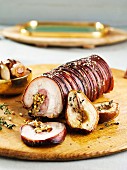 Stuffed roast suckling pig filled with pears and pine nuts