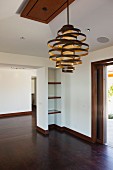 Creative pedant lamp in empty foyer; Newport Beach; California; USA