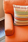 Detail of cushion on orange couch; Azusa; California; USA