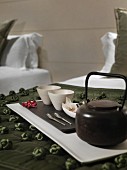 Detail of tea set on tray in bedroom