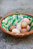 Fresh eggs in a vintage ceramic bowl