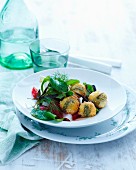 Fried mini mozzarella with sage and a herb salad