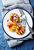 Grilled nectarine halves with blue cheese