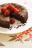 Gluten-free chocolate cake with raspberries