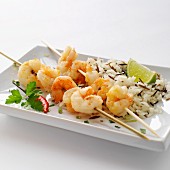 Prawn skewers with wild rice and limes