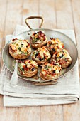 Mushrooms stuffed with mozzarella, dried tomatoes, black olives and herbs