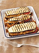Grilled, gratinated aubergines with bulgur and tomatoes