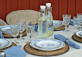 White and blue table settings on veranda