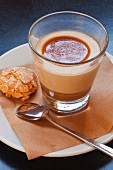Butterscotch pudding with an almond biscuit