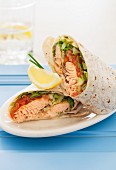 Salmon wraps with mustard, tomato and lettuce