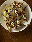 Grilled aubergines with cheese and herbs