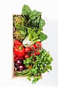 Vegetables and parsley in a wooden basket