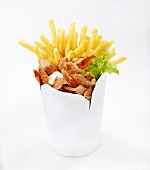 Donner kebab with chips in a takeaway container