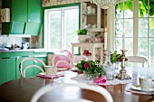 Table set with bowl of flowers and candles