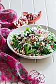 Quinoa salad with spinach and pomegranate seeds