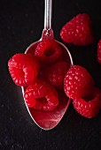 Fresh raspberries on a spoon