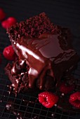 Chocolate cake with chocolate glaze and fresh raspberries