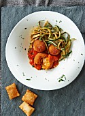 Arancini with tomato sauce and courgettes